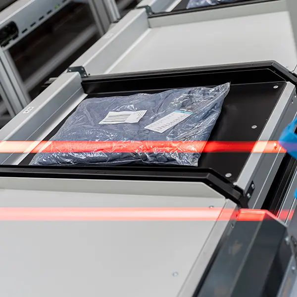 Scanning a prodoct on a push tray sorter